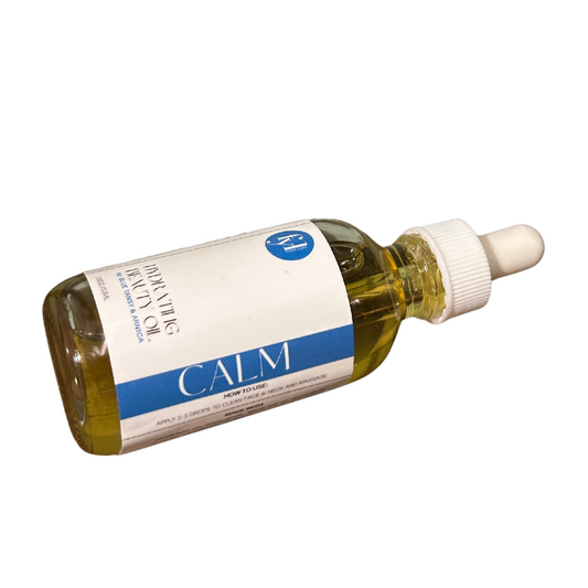 Calm Hydrating Beauty Oil in a glass dropper bottle with blue tansy and arnica for calming redness and acne.