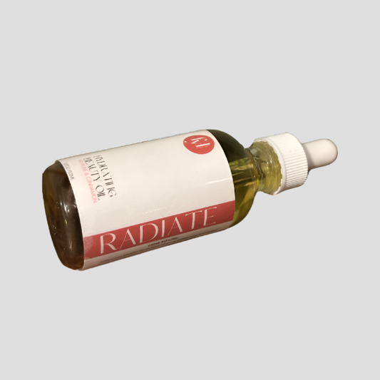 Radiate Hydrating Beauty Oil with rose petals and cinnamon bark in a glass dropper bottle for glowing skin.