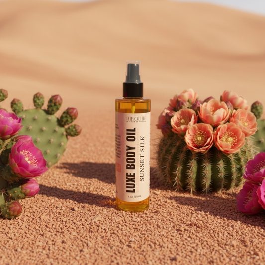Luxe body oil bottle with cacti and flowers in a desert setting