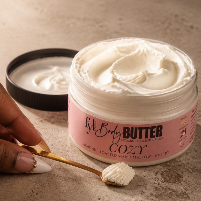 Open jar of Cozy body butter showing its rich creamy texture