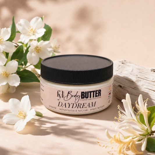 Daydream  moisturizing Body Butter styled with jasmine and honeysuckle flowers representing its fresh floral scent.