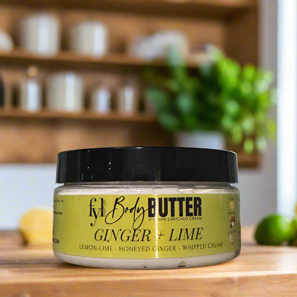 Jar of ginger lime body butter on a tiled bathroom shelf